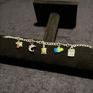 Charm Bracelet. Sterling Silver chain & Charms. Dog, dolphin, turtle, fish, bag.